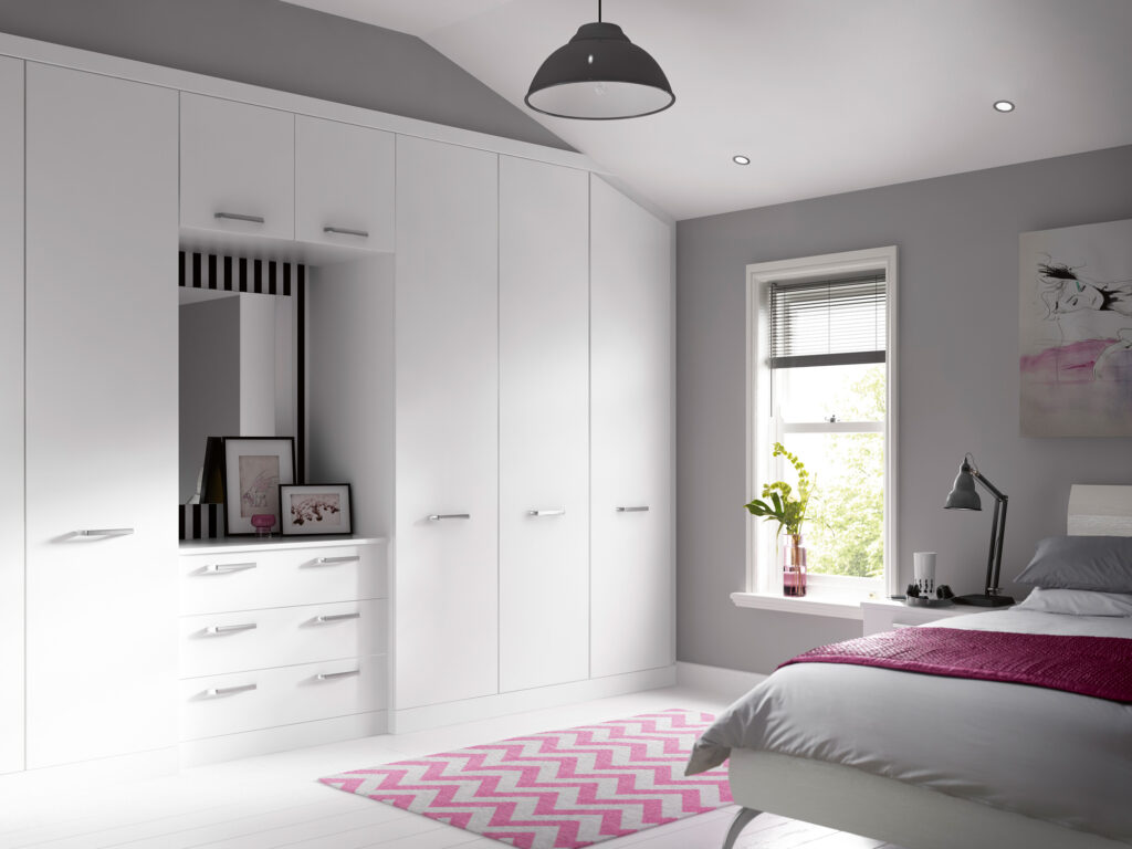 white fitted wardrobes with central drawers